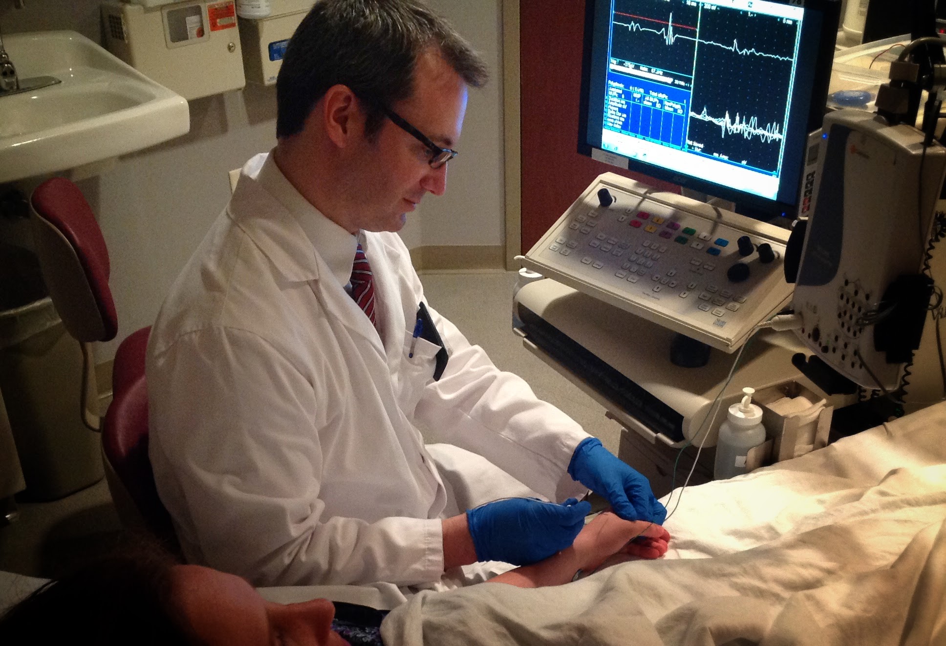 Dr Cullen O'Gorman performing needle EMG testing